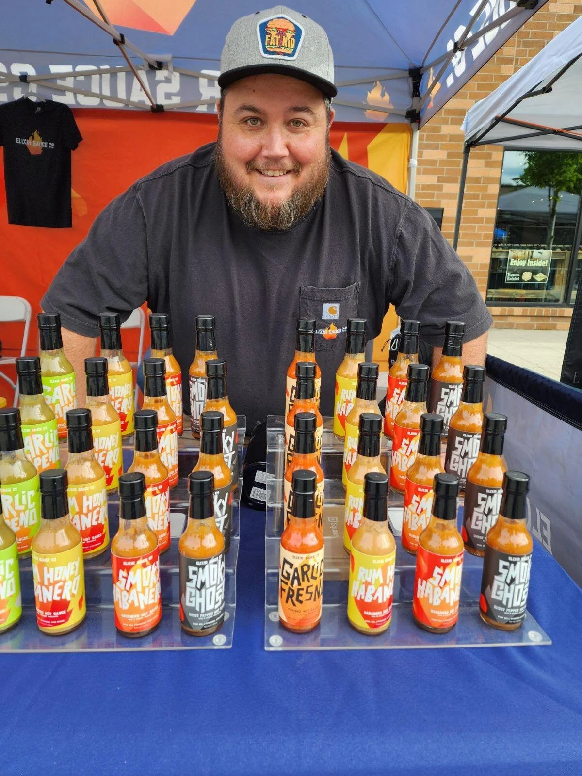 Selling hot sauce at an outdoor event