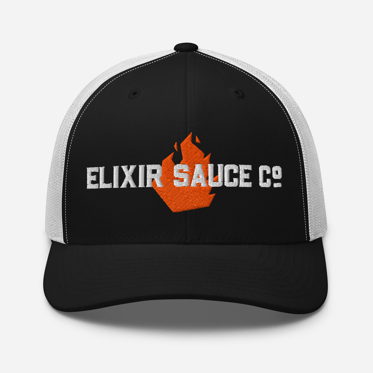 Elixir Sauce Co trucker hat in Black and White with embroidered flame logo, front view